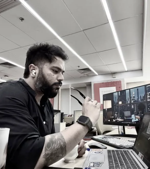 Harshit Gupta working at his desk